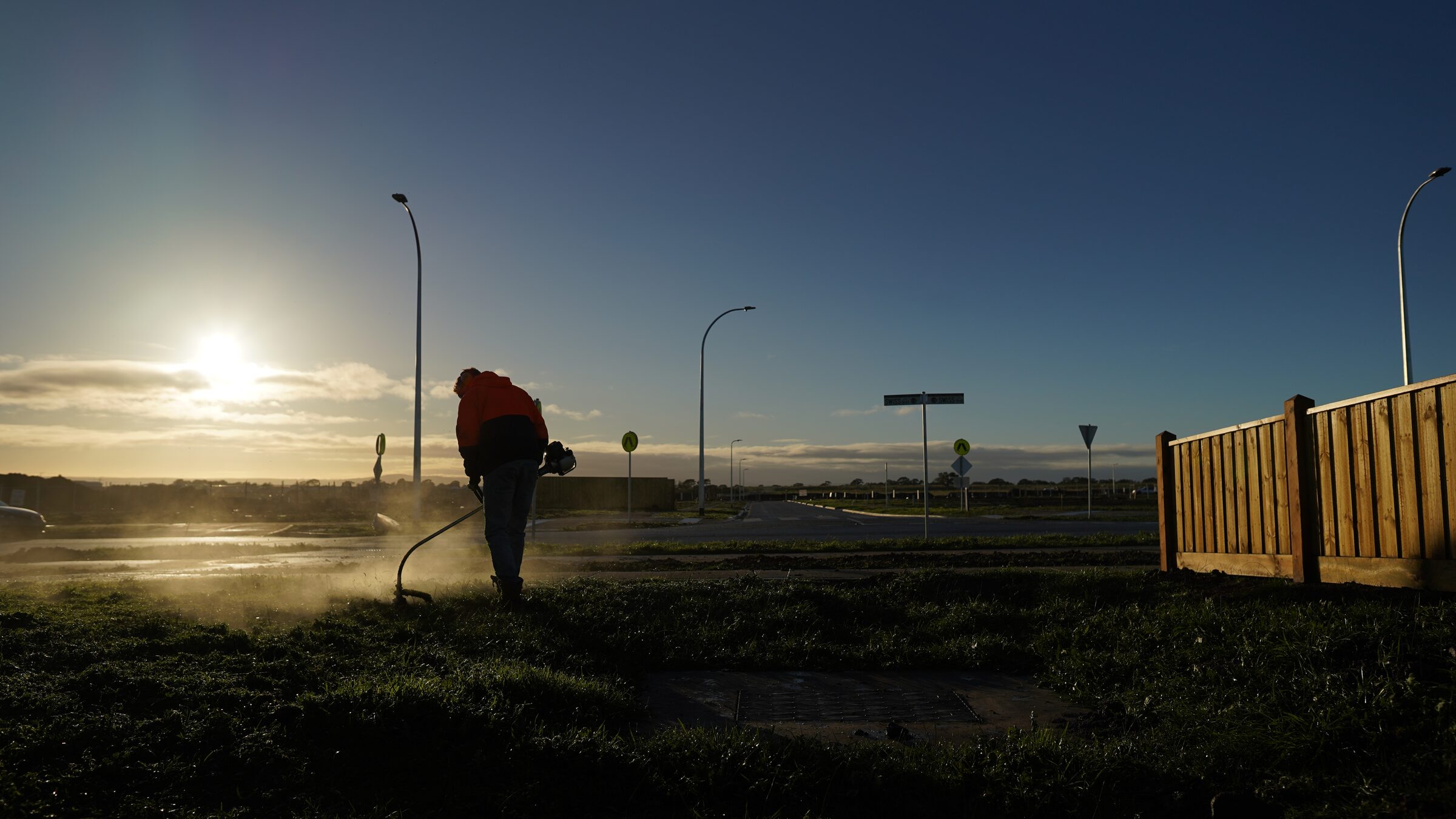 Landscape maintenance work at sunrise